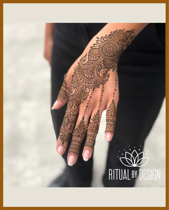Stylish Back Hand Mehndi Design With Leafy Pattern And Petals